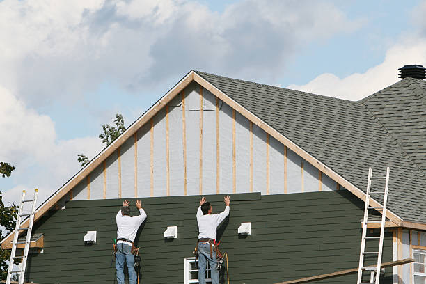 Professional Storm Damage Siding Repair technician working in Medford, MA
